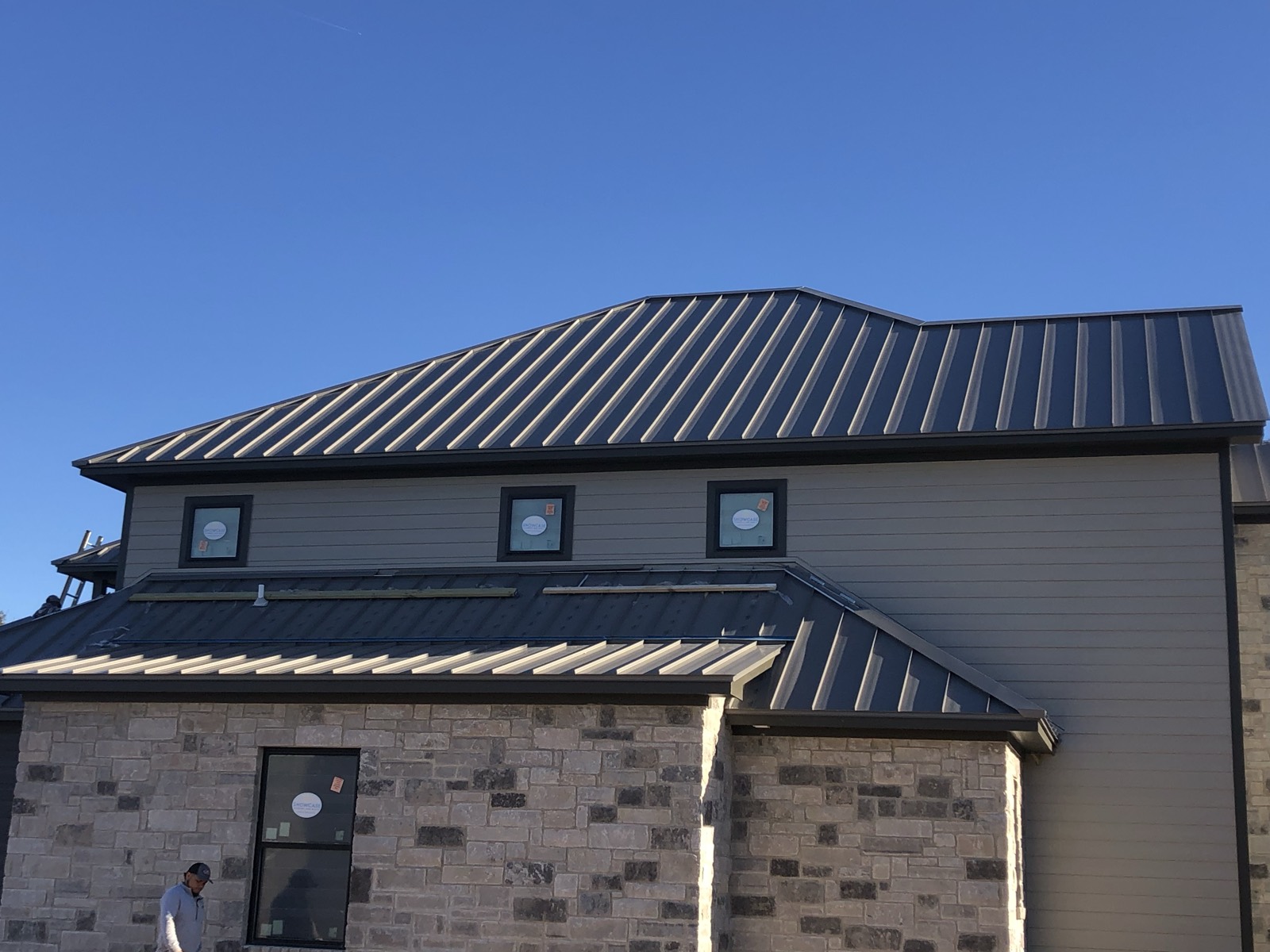 One-piece gutter and clean eave line on a finished roof in Leander, TX