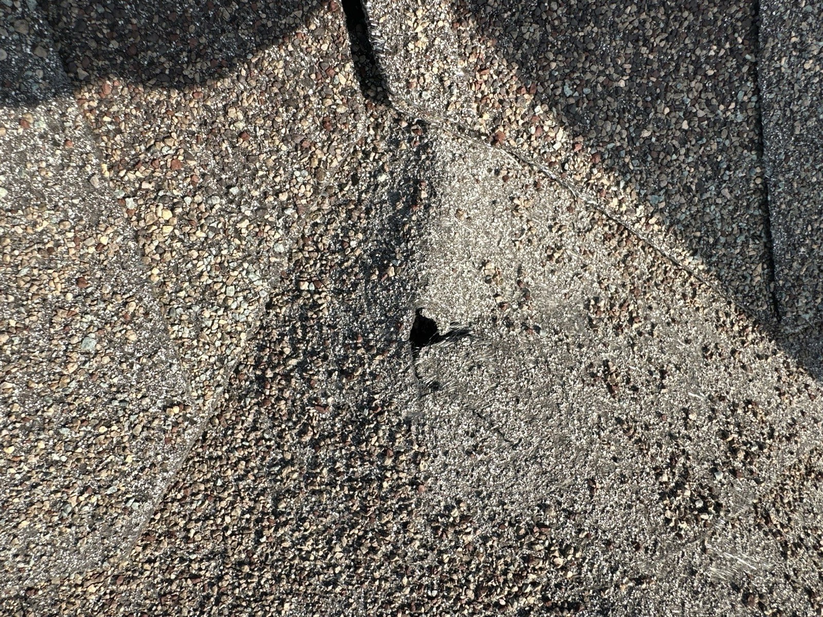 Hail damaged roof being inspected in Leander, TX