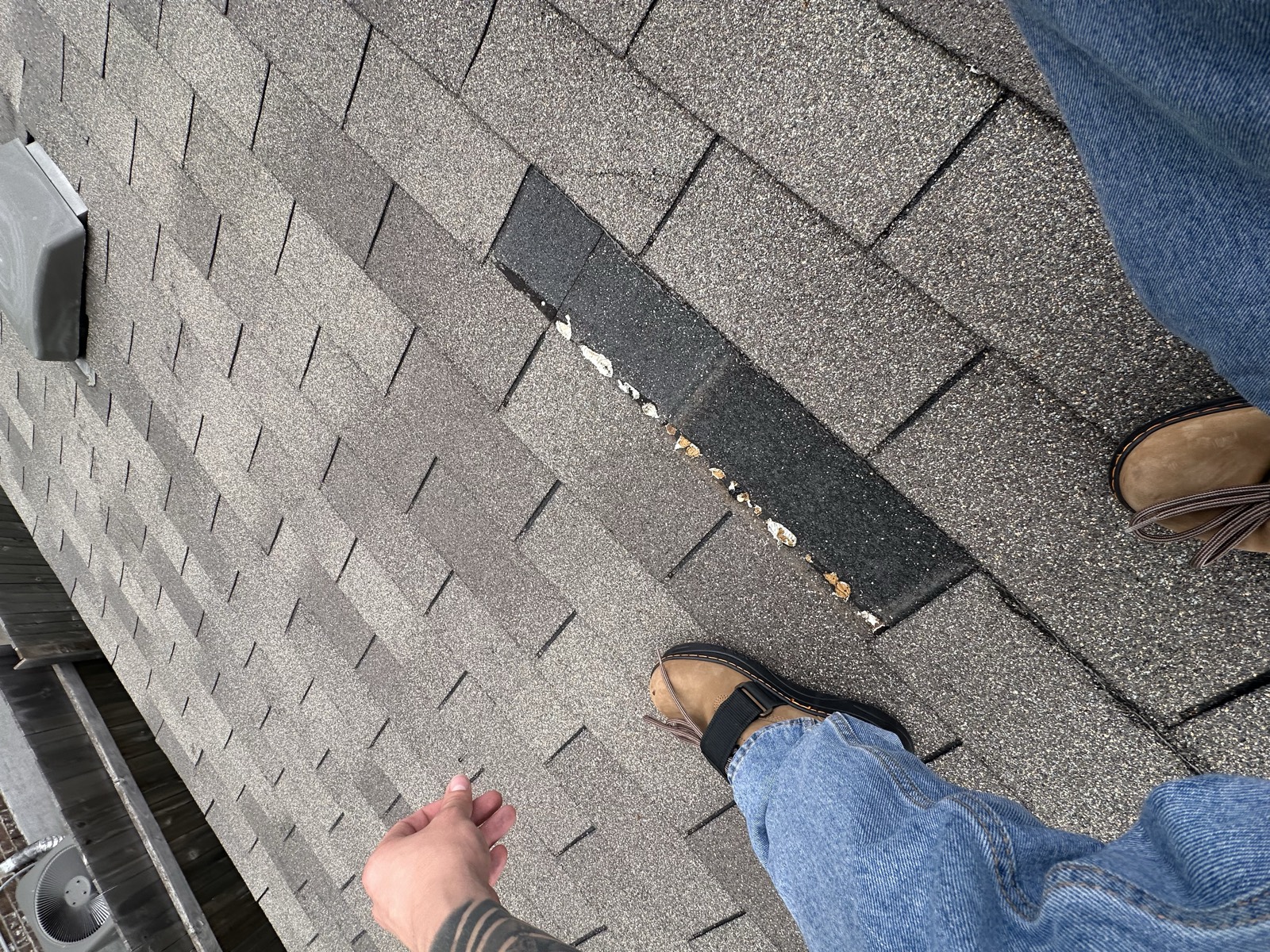 Storm damaged roof being inspected in Leander, TX