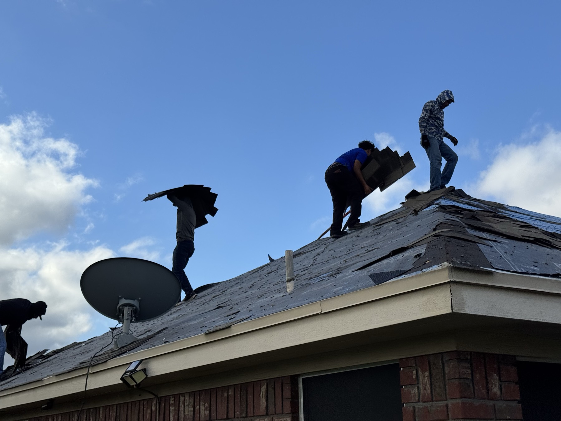 Plenox Solutions crew working a roof replacement in Leander, TX
