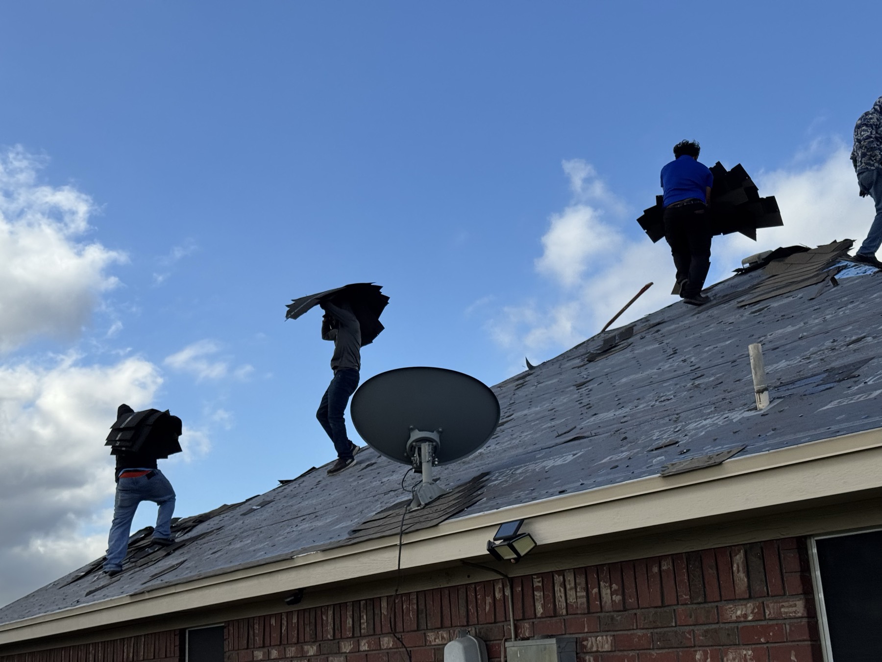 Plenox crew working on a roof in Leander, TX