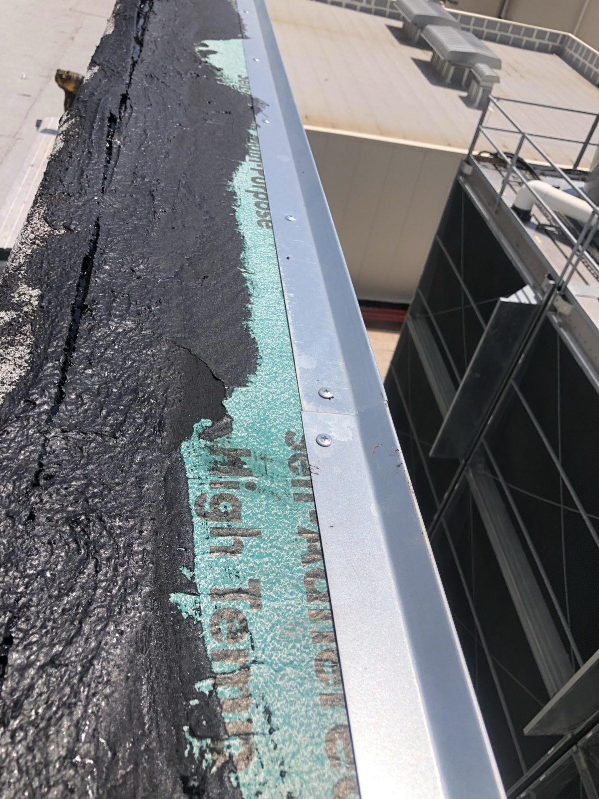 Rooftop HVAC penetrations and flashing on a commercial flat roof in Central Texas